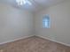 Bright bedroom with neutral walls, carpet, and a window at 943 N 12Th St, Elwood, IN 46036