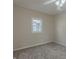 Simple bedroom with neutral walls, carpet, and a window at 943 N 12Th St, Elwood, IN 46036