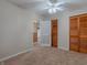Spacious bedroom with carpet, ceiling fan, and closets at 943 N 12Th St, Elwood, IN 46036