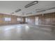 Spacious garage with overhead storage and large door at 943 N 12Th St, Elwood, IN 46036