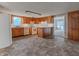 Eat-in kitchen, featuring wood cabinets and a tile floor at 943 N 12Th St, Elwood, IN 46036