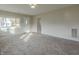 Bright living room with neutral walls, carpet, and large windows at 943 N 12Th St, Elwood, IN 46036