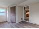 Sunroom with gray flooring and access to the kitchen at 943 N 12Th St, Elwood, IN 46036