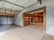 Workshop with double garage doors and open interior at 943 N 12Th St, Elwood, IN 46036