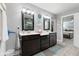Double vanity bathroom with a large mirror and access to a bedroom at 1285 Greenwood Station Blvd, Greenwood, IN 46143