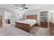 Spacious bedroom with a large bed, dresser, and plenty of natural light at 1285 Greenwood Station Blvd, Greenwood, IN 46143