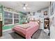 Bedroom with pink bedding, and art on the walls at 1285 Greenwood Station Blvd, Greenwood, IN 46143