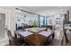 Bright dining area with a square wooden table and four chairs, near kitchen at 1285 Greenwood Station Blvd, Greenwood, IN 46143