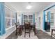 Charming dining room with a wood table, four chairs, and window seating at 1285 Greenwood Station Blvd, Greenwood, IN 46143