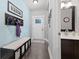 Bright entryway with a bench, coat rack, and adjacent powder room at 1285 Greenwood Station Blvd, Greenwood, IN 46143
