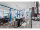 Open concept kitchen with granite island, stainless steel appliances, and decorative wallpaper at 1285 Greenwood Station Blvd, Greenwood, IN 46143