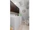 Bright laundry room, washer, dryer, cabinets, and tile floor at 1285 Greenwood Station Blvd, Greenwood, IN 46143