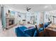 Cozy living room with a fireplace, sectional sofa, and large-screen TV at 1285 Greenwood Station Blvd, Greenwood, IN 46143