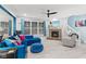 Spacious living room featuring a fireplace, sectional sofa, and ceiling fan at 1285 Greenwood Station Blvd, Greenwood, IN 46143