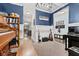Music room with piano, organ, guitars and view into kitchen at 1285 Greenwood Station Blvd, Greenwood, IN 46143