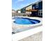 Modern pool with a pergola and a grey concrete patio at 1285 Greenwood Station Blvd, Greenwood, IN 46143