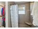Shower stall with patterned curtain and built-in seat at 3265 W 50 S, Lebanon, IN 46052
