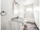 Clean bathroom with white vanity, granite countertop, and tiled shower at 425 Sanders St, Indianapolis, IN 46225
