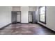 Well-lit bedroom featuring dual closets and wood-look floors at 425 Sanders St, Indianapolis, IN 46225