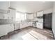 Modern kitchen with white cabinets, granite countertops and stainless steel appliances at 425 Sanders St, Indianapolis, IN 46225
