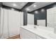 Clean bathroom with white vanity, chevron shower curtain, and dark grey walls at 5784 N 600 E, Greenfield, IN 46140