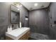 Modern bathroom with a large walk-in shower, double vanity, and sleek fixtures at 5784 N 600 E, Greenfield, IN 46140