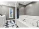 Bathroom with soaking tub and checkered floor at 5784 N 600 E, Greenfield, IN 46140