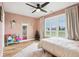 Charming bedroom with a light pink color scheme and a built-in bookshelf at 5784 N 600 E, Greenfield, IN 46140