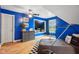 Blue bedroom with a race car bed, window seat, and a dresser at 5784 N 600 E, Greenfield, IN 46140