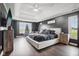 Spacious main bedroom with a large bed, plenty of natural light, and a dark accent wall at 5784 N 600 E, Greenfield, IN 46140