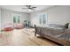 Bedroom with a queen bed, treadmill, and two mini trampolines at 5784 N 600 E, Greenfield, IN 46140