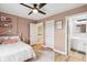 Light pink bedroom with a queen-size bed and an ensuite bathroom at 5784 N 600 E, Greenfield, IN 46140