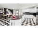 Modern kitchen featuring white cabinets, black tile backsplash, and a large island at 5784 N 600 E, Greenfield, IN 46140