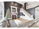 Two-story living room with fireplace, built-in shelving and hardwood floors at 5784 N 600 E, Greenfield, IN 46140