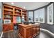 Home office with built-in wooden shelving and a large desk at 5784 N 600 E, Greenfield, IN 46140