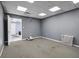 Simple office space with gray walls, carpeted floors, and ample natural light at 5784 N 600 E, Greenfield, IN 46140