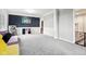 Bright playroom featuring gray carpeting and a built-in storage unit at 5784 N 600 E, Greenfield, IN 46140
