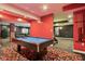 Finished basement game room featuring a pool table and vibrant decor at 5784 N 600 E, Greenfield, IN 46140