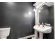 Elegant powder room with pedestal sink and dark gray walls at 5784 N 600 E, Greenfield, IN 46140
