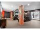 Finished basement rec room with comfortable seating, a large TV, and brick accents at 5784 N 600 E, Greenfield, IN 46140