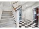 Elegant staircase with carpeted steps and a white railing at 5784 N 600 E, Greenfield, IN 46140