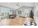 Sunroom with hardwood floors, vaulted ceilings and multiple windows at 5784 N 600 E, Greenfield, IN 46140