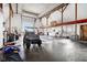 Spacious workshop with high ceilings, large door, and ample space for vehicles and equipment at 5784 N 600 E, Greenfield, IN 46140