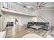 Open living room with loft, hardwood floors and kitchen views at 5909 Buttonwood Dr, Noblesville, IN 46062