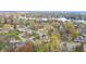 Aerial view of neighborhood near lake in autumn at 5909 Buttonwood Dr, Noblesville, IN 46062