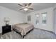 Cozy bedroom with a full bed, two windows, and ceiling fan at 5909 Buttonwood Dr, Noblesville, IN 46062