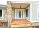 Inviting front entrance with a stone facade and a glass front door at 5909 Buttonwood Dr, Noblesville, IN 46062