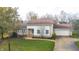 Lovely house exterior with stone accents and a well-maintained lawn at 5909 Buttonwood Dr, Noblesville, IN 46062