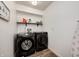 Functional laundry room with washer, dryer, and additional shelving at 5909 Buttonwood Dr, Noblesville, IN 46062