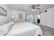 Main bedroom with king bed, barn door to bathroom, and backyard access at 5909 Buttonwood Dr, Noblesville, IN 46062
